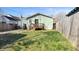 Spacious backyard with deck, mature trees, and lawn at 4929 Kingsley Dr, Indianapolis, IN 46205