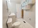 Modern bathroom with dual vanities, marble floors, and contemporary fixtures at 4929 Kingsley Dr, Indianapolis, IN 46205