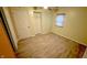 Bedroom with hardwood floors, closet, and a bright window, creating a comfortable and functional space at 4929 Kingsley Dr, Indianapolis, IN 46205