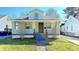 Inviting two-story home with covered front porch and well-maintained lawn at 4929 Kingsley Dr, Indianapolis, IN 46205