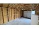 Spacious garage with shelving, garage door, and side entry for easy access at 4929 Kingsley Dr, Indianapolis, IN 46205
