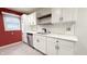 Bright kitchen with white cabinets, subway tile backsplash, stainless steel appliances, and granite countertops at 4929 Kingsley Dr, Indianapolis, IN 46205