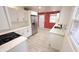 Open kitchen layout with stainless steel appliances, granite countertops, and subway tile backsplash, seamlessly integrated at 4929 Kingsley Dr, Indianapolis, IN 46205