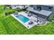 Aerial view showcasing pool, patio and outdoor living spaces in a beautifully landscaped yard at 5120 Melbourne Pl, Zionsville, IN 46077
