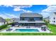 Aerial view of a luxurious in-ground pool and lounge area in a spacious backyard at 5120 Melbourne Pl, Zionsville, IN 46077