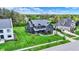 Aerial view of a well-manicured lawn and front yard of a house showing lush landscaping at 5120 Melbourne Pl, Zionsville, IN 46077