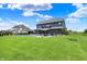 Expansive backyard showcasing a sparkling pool, outdoor seating, manicured lawn, perfect for entertaining and relaxation at 5120 Melbourne Pl, Zionsville, IN 46077