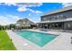 A large in-ground pool is the focal point of this home's backyard at 5120 Melbourne Pl, Zionsville, IN 46077