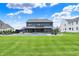 Lush backyard highlighting a pristine pool area, outdoor lounging, and expansive green space, perfect for outdoor enjoyment at 5120 Melbourne Pl, Zionsville, IN 46077