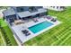 Aerial view of a stunning backyard with a sparkling pool, patio area and lush green lawn at 5120 Melbourne Pl, Zionsville, IN 46077