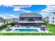 Gorgeous backyard includes a sparkling pool, lounging area, and a manicured lawn for outdoor enjoyment at 5120 Melbourne Pl, Zionsville, IN 46077