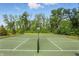 Enjoy a game on the community basketball and volleyball court surrounded by lush green trees and fencing at 5120 Melbourne Pl, Zionsville, IN 46077