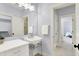 Classic bathroom with a pedestal sink, ample lighting, and neutral tones creating a calming space at 5120 Melbourne Pl, Zionsville, IN 46077