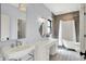 Bright bathroom featuring vintage style sink, standing tub, shower, and vanity at 5120 Melbourne Pl, Zionsville, IN 46077