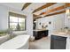 Bright bathroom featuring a soaking tub, vanity with makeup area, chandelier, and view at 5120 Melbourne Pl, Zionsville, IN 46077