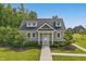 Quaint clubhouse showcasing stone accents and well-manicured landscaping in front at 5120 Melbourne Pl, Zionsville, IN 46077