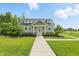 Beautiful clubhouse showcasing a well-maintained lawn and landscaped garden at 5120 Melbourne Pl, Zionsville, IN 46077