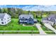 Stunning two-story home featuring lush lawn, professionally landscaped yard, and a classic architectural design at 5120 Melbourne Pl, Zionsville, IN 46077