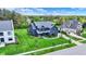 Beautiful two-story home showing verdant lawn, pristine landscaping, and timeless curb appeal at 5120 Melbourne Pl, Zionsville, IN 46077