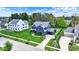 Aerial view of a beautifully landscaped home with a well-manicured lawn, mature trees, and charming curb appeal at 5120 Melbourne Pl, Zionsville, IN 46077