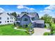 Beautiful home featuring manicured lawn, driveway, and charming curb appeal at 5120 Melbourne Pl, Zionsville, IN 46077