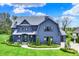 Stunning two-story home with a beautifully landscaped front yard and charming architectural details at 5120 Melbourne Pl, Zionsville, IN 46077