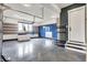 Spacious garage with epoxy flooring, overhead storage, and built-in storage cabinets at 5120 Melbourne Pl, Zionsville, IN 46077