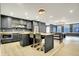 Finished basement with open kitchen including an island, bar seating and stainless appliances at 5120 Melbourne Pl, Zionsville, IN 46077
