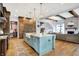 Gourmet kitchen boasts a large island, hardwood floors, custom cabinets, and stainless appliances at 5120 Melbourne Pl, Zionsville, IN 46077