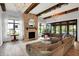 Bright living room with fireplace, comfortable seating, and seamless flow to outdoor patio at 5120 Melbourne Pl, Zionsville, IN 46077
