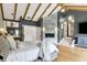 Inviting main bedroom suite with vaulted ceiling, wood floors, and fireplace for cozy relaxation at 5120 Melbourne Pl, Zionsville, IN 46077