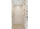 Luxurious walk-in shower with multiple shower heads, bench, and neutral tile at 5120 Melbourne Pl, Zionsville, IN 46077