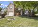 Charming two-story brick home with manicured front yard and mature trees, creating a welcoming curb appeal at 5304 Lily Pad Ln, Indianapolis, IN 46237