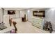 This is the basement area including a wall-mounted electric fireplace at 5330 Manker St, Indianapolis, IN 46227