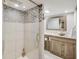 This bathroom features an elegant glass shower and a modern sink with wood cabinets at 5330 Manker St, Indianapolis, IN 46227