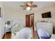 Cozy bedroom with a ceiling fan and a view from the chair to the television at 5330 Manker St, Indianapolis, IN 46227