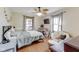 This bedroom is bright with natural light and features a unique ceiling fan at 5330 Manker St, Indianapolis, IN 46227