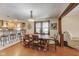 Inviting dining room with hardwood floors, decorative lighting, and open access to the modern kitchen and living area at 5330 Manker St, Indianapolis, IN 46227