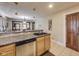 The kitchen features a stainless steel dishwasher and tiled flooring at 5330 Manker St, Indianapolis, IN 46227