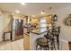 Bright, modern kitchen with stainless steel appliances, breakfast bar, and stylish decor, perfect for cooking and entertaining at 5330 Manker St, Indianapolis, IN 46227