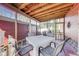 Inviting screened-in porch with comfortable seating arrangement at 5330 Manker St, Indianapolis, IN 46227