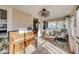 Inviting sunroom featuring bright windows, a piano, cozy seating, and decorative lighting, perfect for relaxation at 5330 Manker St, Indianapolis, IN 46227