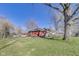 Wide angle showing expansive, grassy backyard and the home's exterior, ideal for outdoor activities and relaxation at 5330 Manker St, Indianapolis, IN 46227