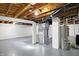 A finished basement with exposed ductwork and mechanicals at 5350 E 20Th Pl, Indianapolis, IN 46218
