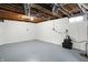 A finished basement with exposed ductwork and concrete walls at 5350 E 20Th Pl, Indianapolis, IN 46218