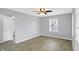 Spacious bedroom featuring neutral walls, vinyl flooring, and plenty of natural light at 5350 E 20Th Pl, Indianapolis, IN 46218