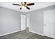A simple bedroom featuring white doors and wood-look flooring at 5350 E 20Th Pl, Indianapolis, IN 46218