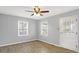 Bright living room featuring vinyl floors and a ceiling fan at 5350 E 20Th Pl, Indianapolis, IN 46218