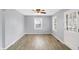 Bright living room featuring vinyl floors and a ceiling fan at 5350 E 20Th Pl, Indianapolis, IN 46218