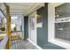 Inviting front porch features detailed railings and a secure entry door at 5350 E 20Th Pl, Indianapolis, IN 46218